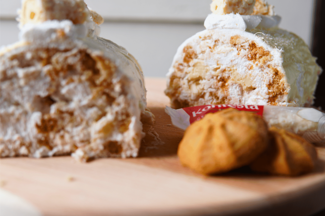 Kokos rolat na drvenoj dasci, Coconut roll on a wooden plate